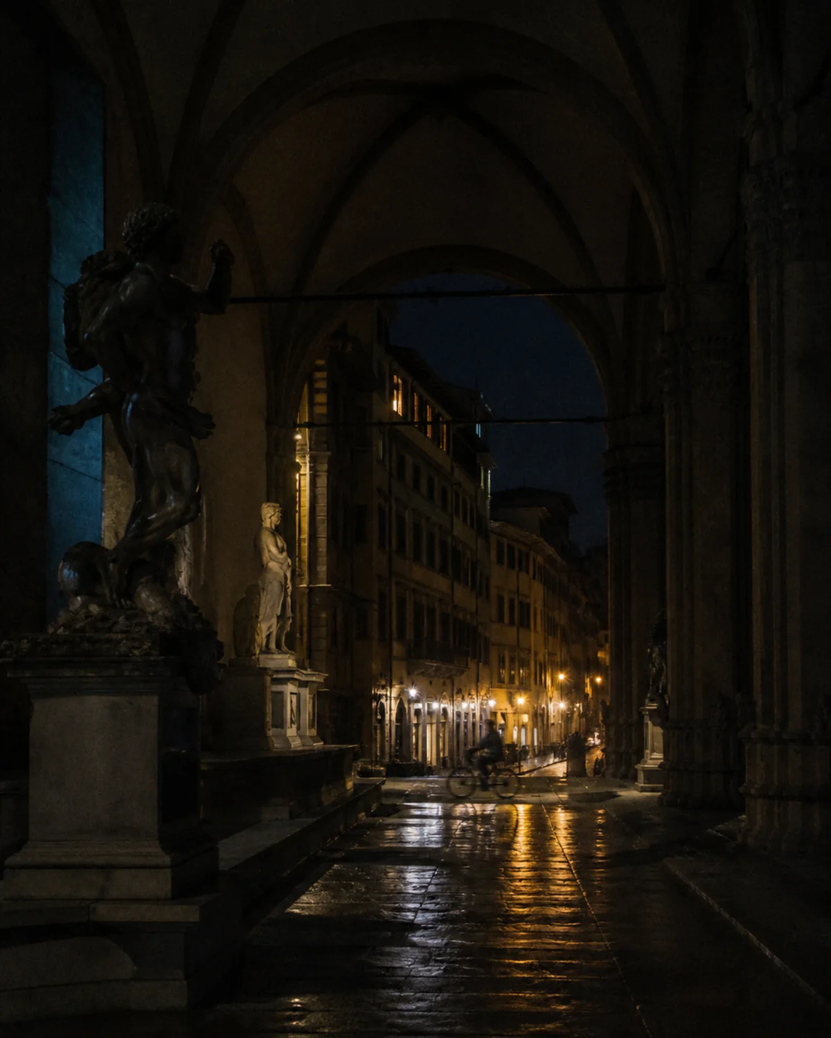 A rain-darkened Florentine loggia at night